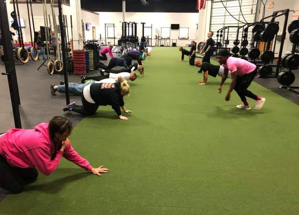 Clients Working Out In Gym As A Group